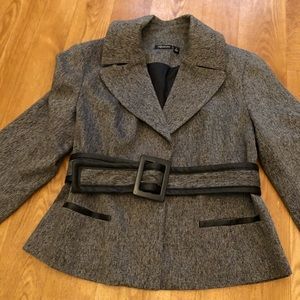 A gray blazer with leather trimming